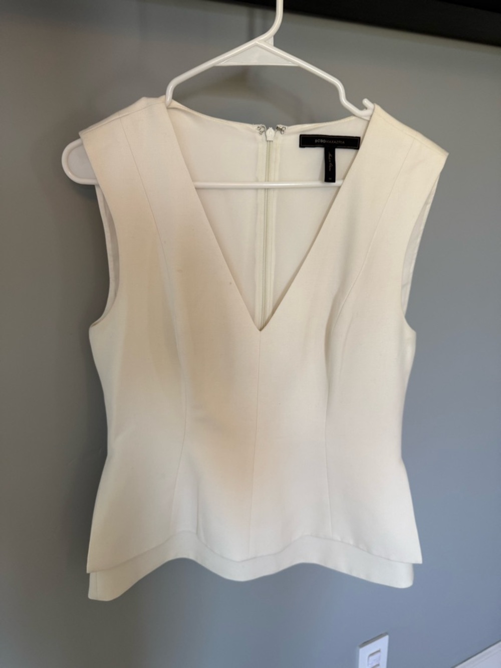 BCBGMaxAzria Ivory V-Neck Sleeveless Peplum Top